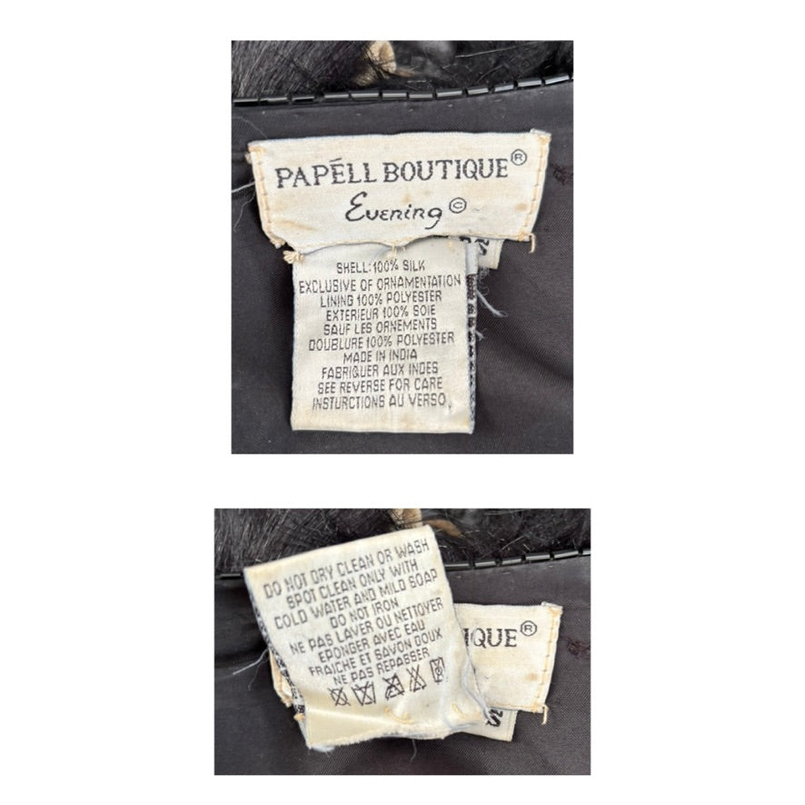 Close-up of clothing labels with 'Papélli Boutique' branding on a garment.