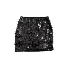 Black sequin skirt on a white background