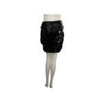 Black sequin skirt on a mannequin against a white background