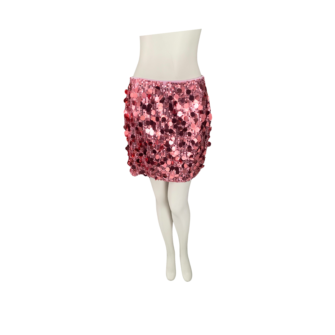 Pink sequin skirt on a mannequin against a white background