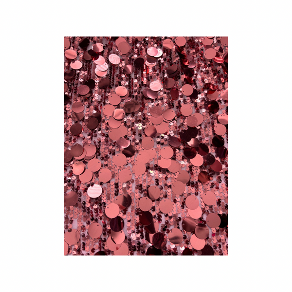 Pink sequin pattern on a white background