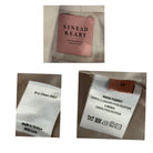 Collage of clothing labels with 'Sinead Keary' branding and fabric information.