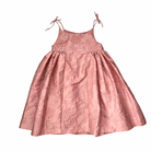 New Sister Jane pink jacquard midi dress with bow tie straps and full skirt, size L, laid flat.
