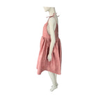 Mannequin wearing a pink dress on a white background