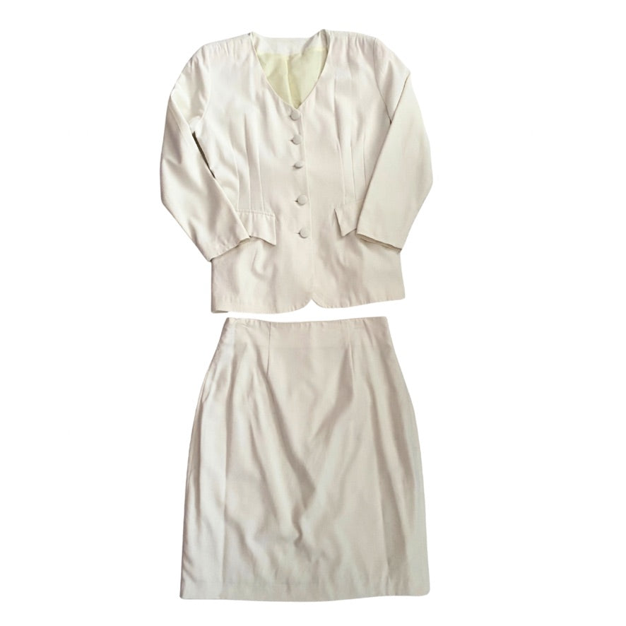 Cream suit with jacket and skirt on a white background