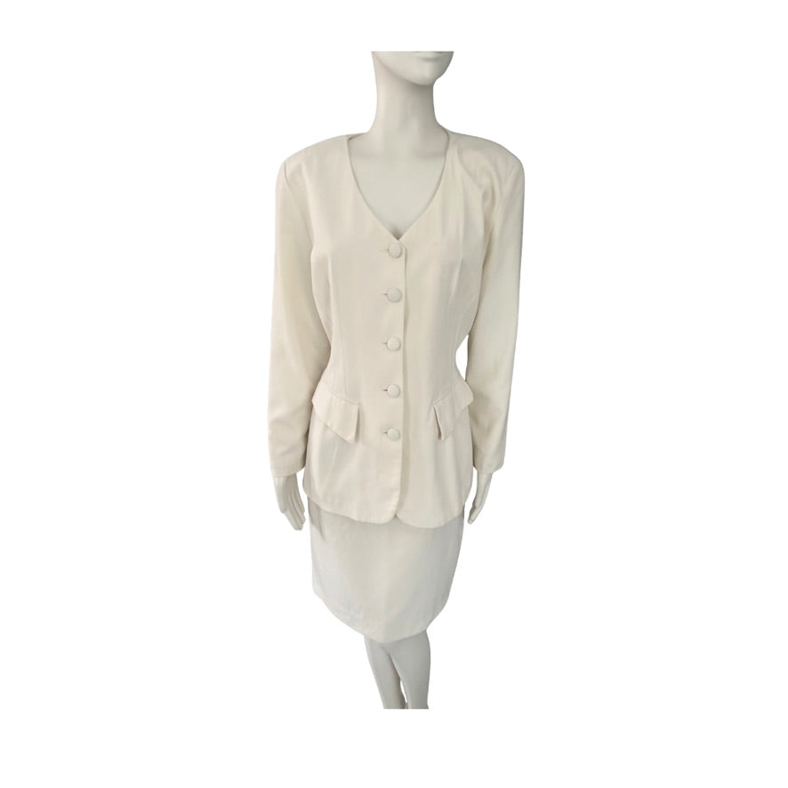 Mannequin wearing a cream-colored skirt and blazer suit on a white background