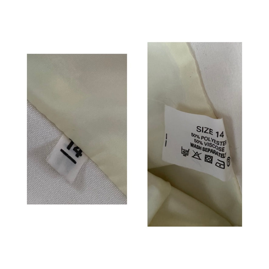 Clothing tag with size label and care instructions on a fabric background