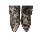 Snakeskin-patterned boots on a white background