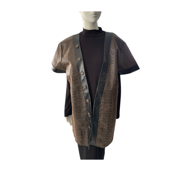 Mannequin wearing a patterned cardigan over a black turtleneck on a white background