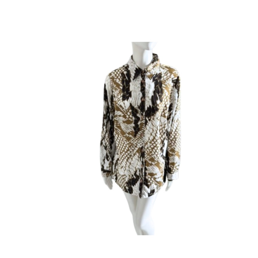 Snakeskin patterned shirt on a mannequin against a white background