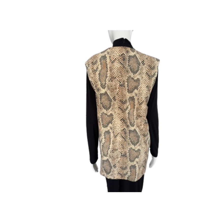 Mannequin wearing a black dress with a snake print vest on a white background