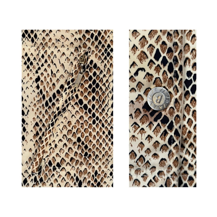 Zip and button on snake skin pattern and brand logo on a white background