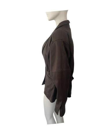 Brown jacket on a mannequin against a white background