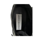 Black shoe with 'Jessica Burman' label on a white background