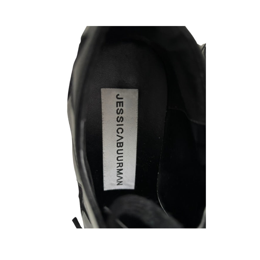 Black shoe with 'Jessica Burman' label on a white background