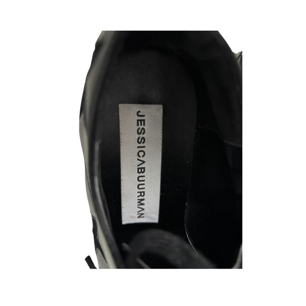 Black shoe with 'Jessica Burman' label on a white background