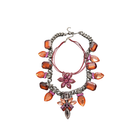 Necklace with colorful beads and floral elements on a white background