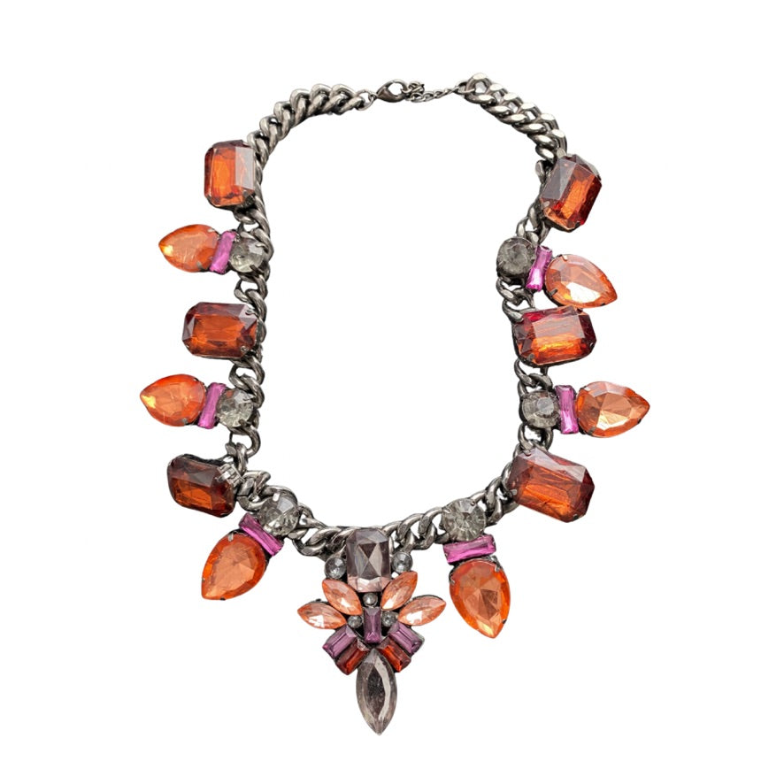 Necklace with orange and pink gemstones on a white background