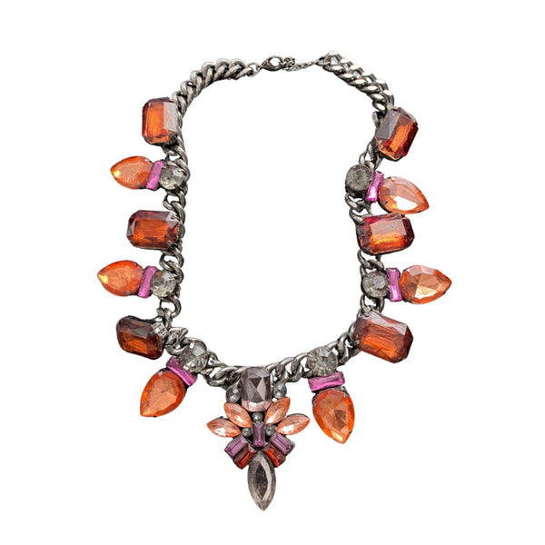 Necklace with orange and pink gemstones on a white background