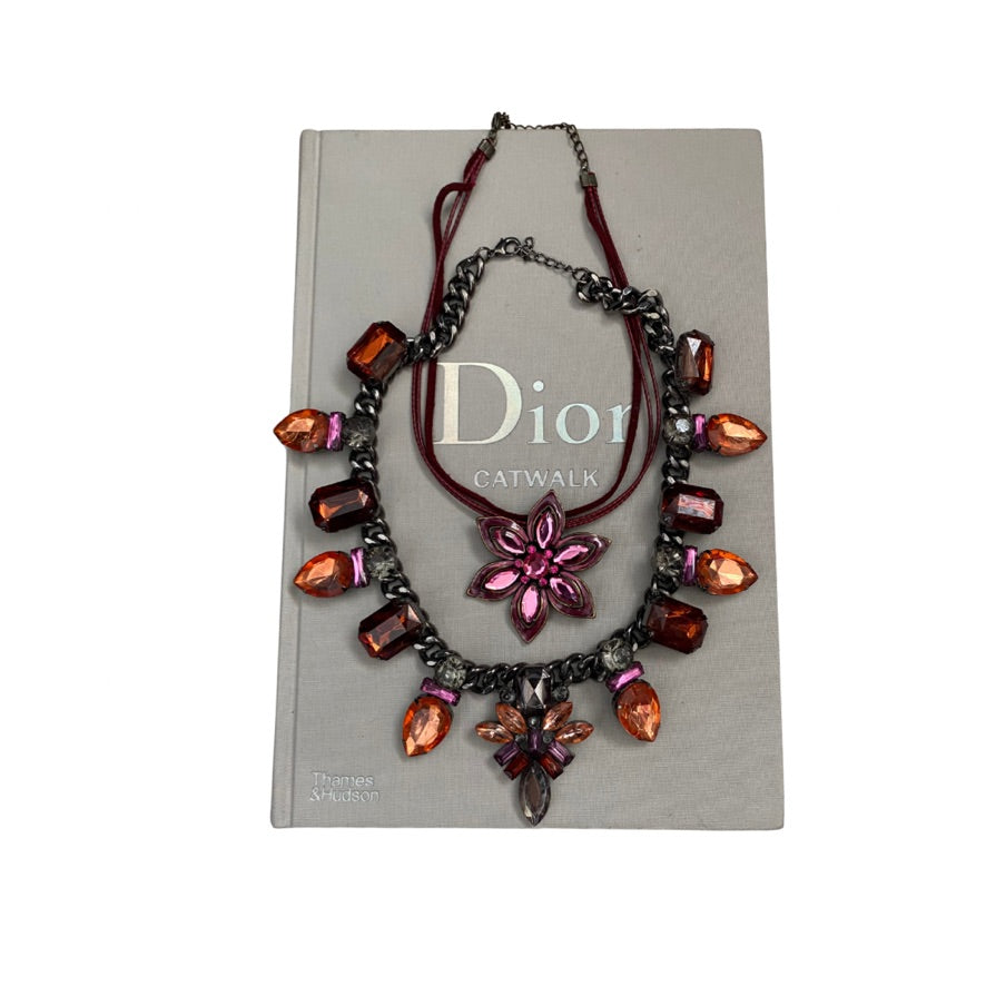Necklace with colorful stones on a Dior Catwalk book