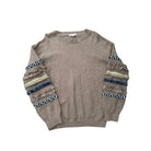 Brown sweater with patterned sleeves on a white background