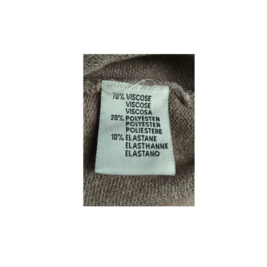 Fabric label with material composition details on a textured fabric background