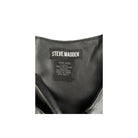 Close-up of a Steve Madden label on a black leather product.