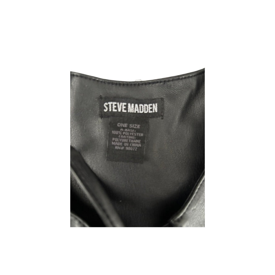 Close-up of a Steve Madden label on a black leather product.