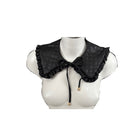 Black quilted collar on a mannequin bust against a white background