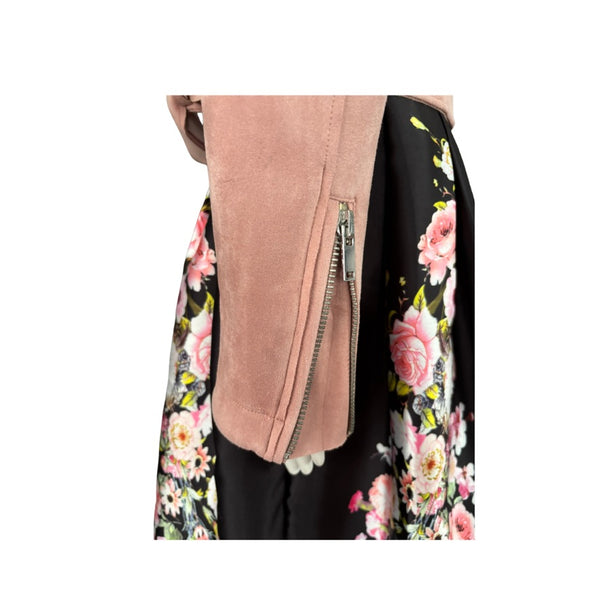 Close-up of a floral-patterned garment with a pink zipper.