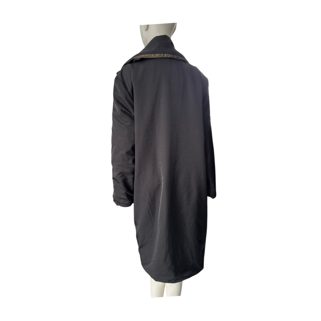 Dark gray coat on a mannequin against a white background