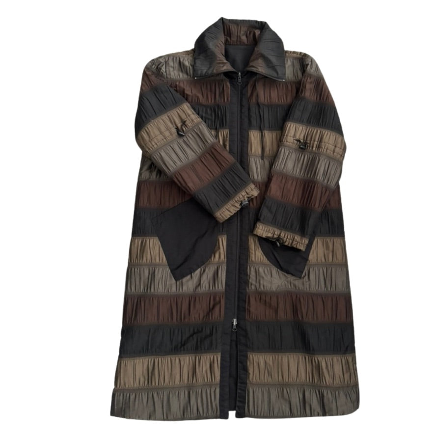 Long, striped coat with a pattern of brown, black, and beige on a white background