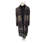 Plaid patterned coat on a mannequin against a white background