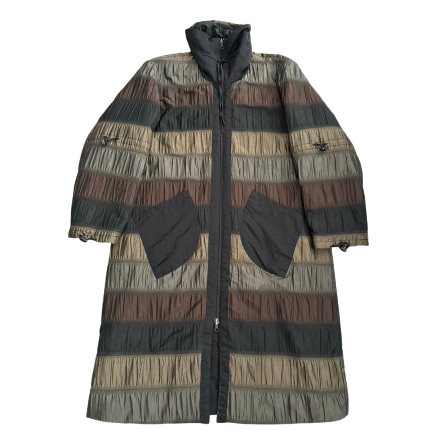 Long, patterned coat with a mix of colors on a white background