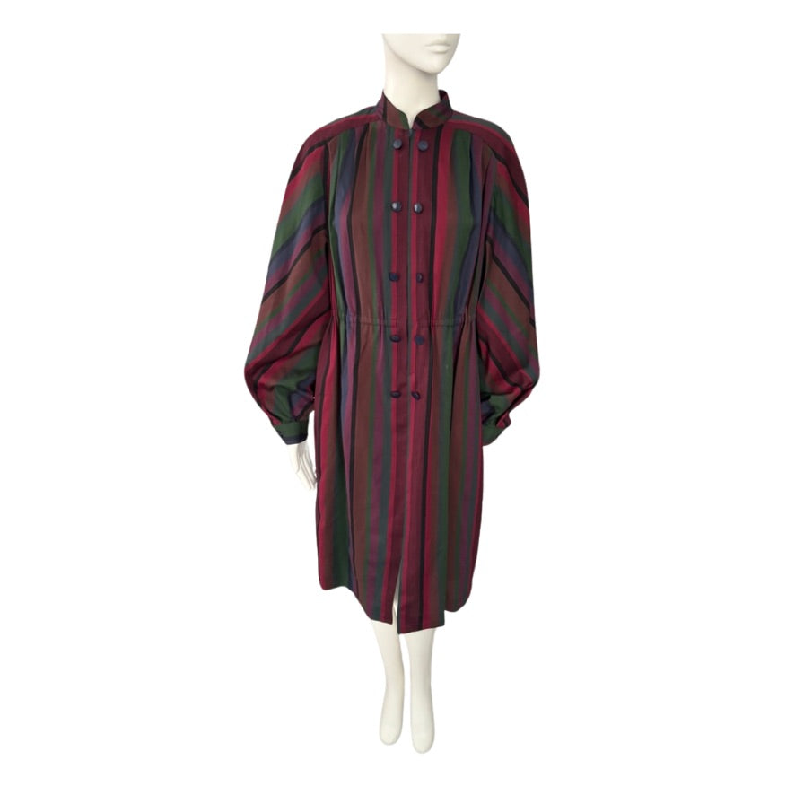 Mannequin wearing a burgundy and green striped dress on a white background