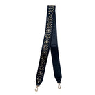 A black handbag strap with gold studded details and gold-tone hardware.