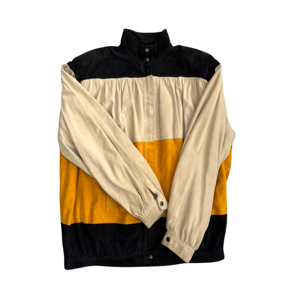Color-blocked shirt with black, yellow, and beige sections on a white background