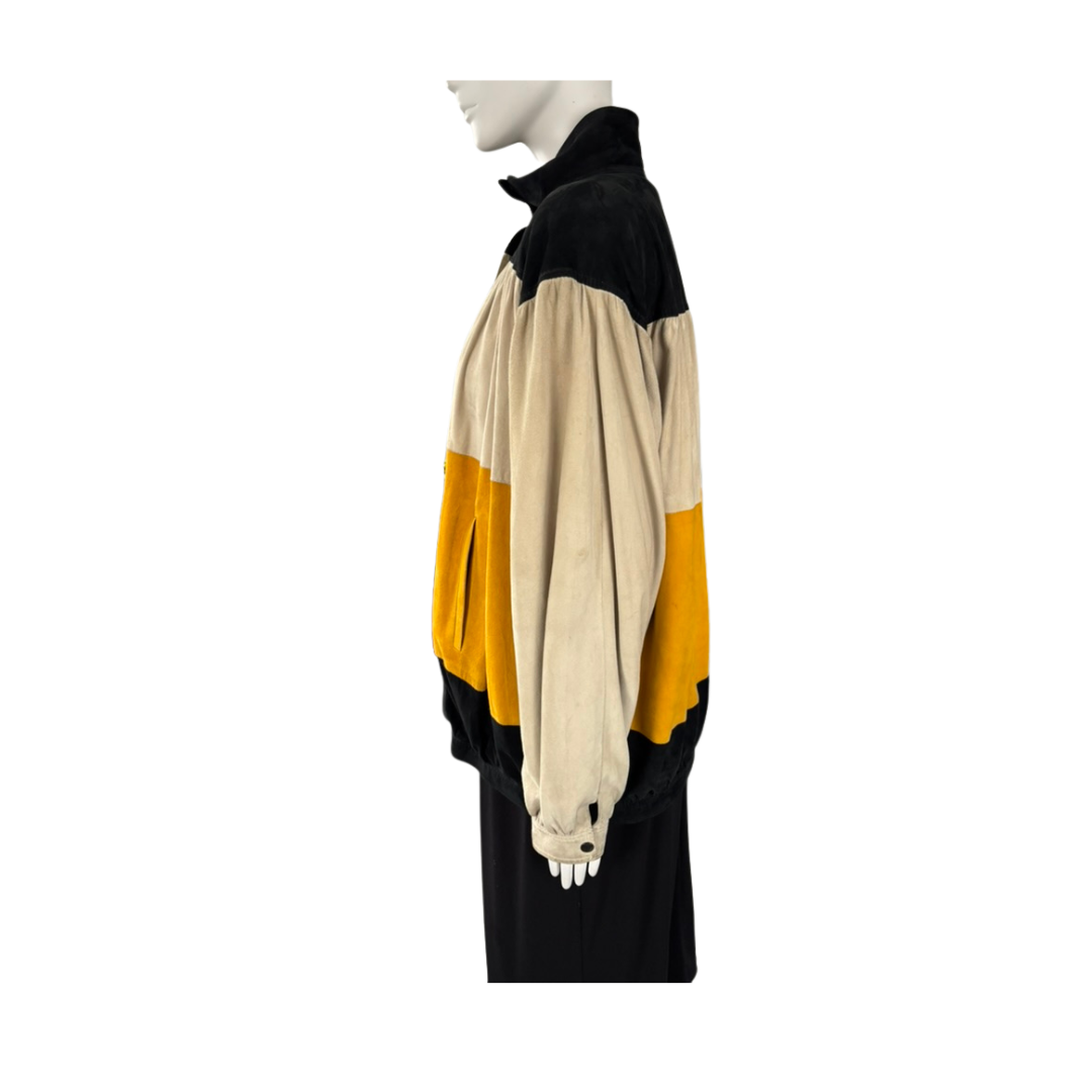 Mannequin wearing a black, yellow, and beige color-blocked outfit on a white background