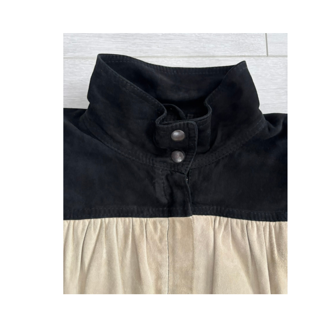 Black and beige dress with a buttoned collar on a white background