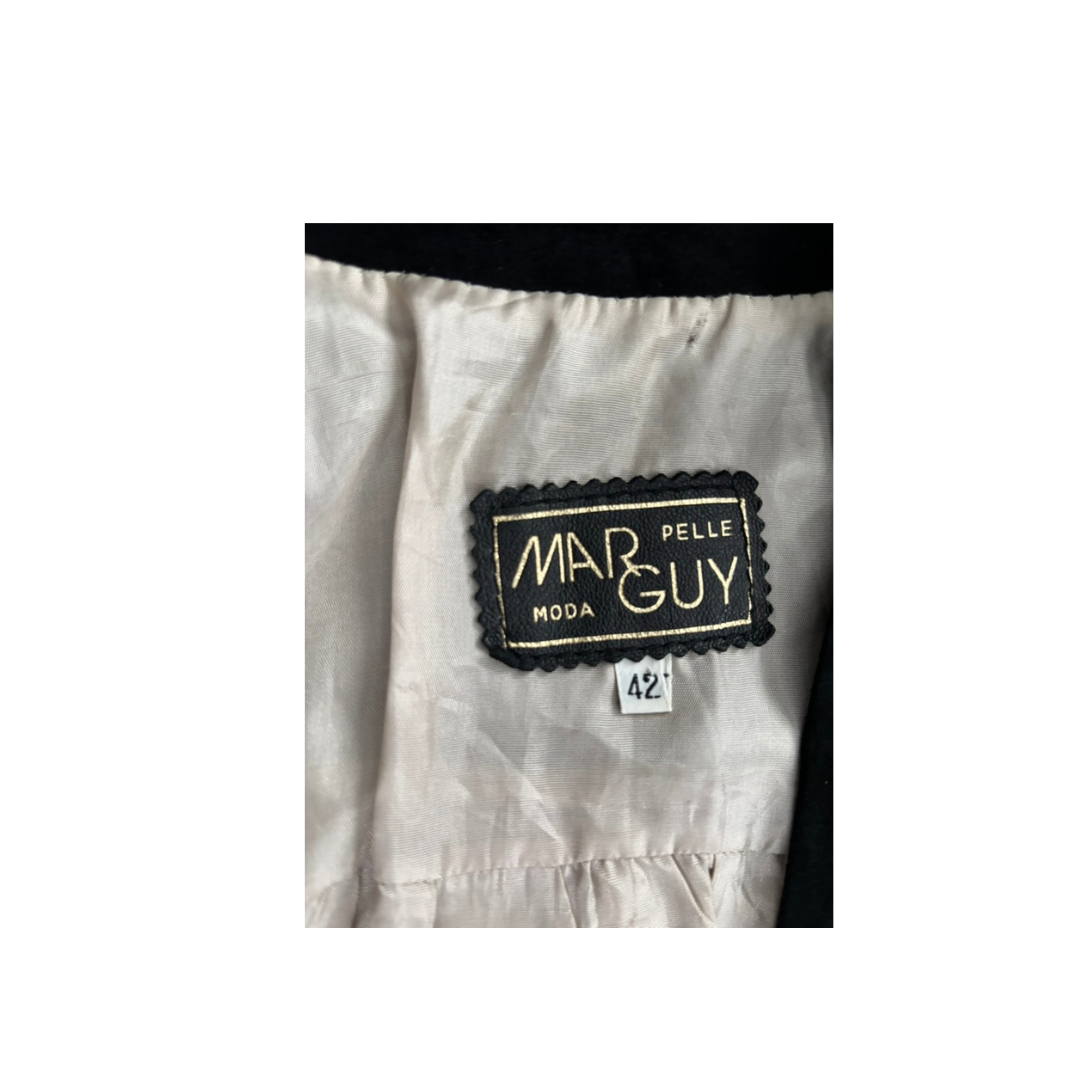 Pelle Guy Moda label on a white garment with a black border