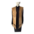 Mannequin wearing a brown leather vest with fringe on a white background