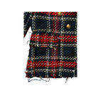 Plaid fabric with red, black, and gold pattern on a white background