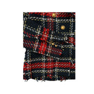 Close-up of a plaid fabric with red, black, and gold colors on a white background.