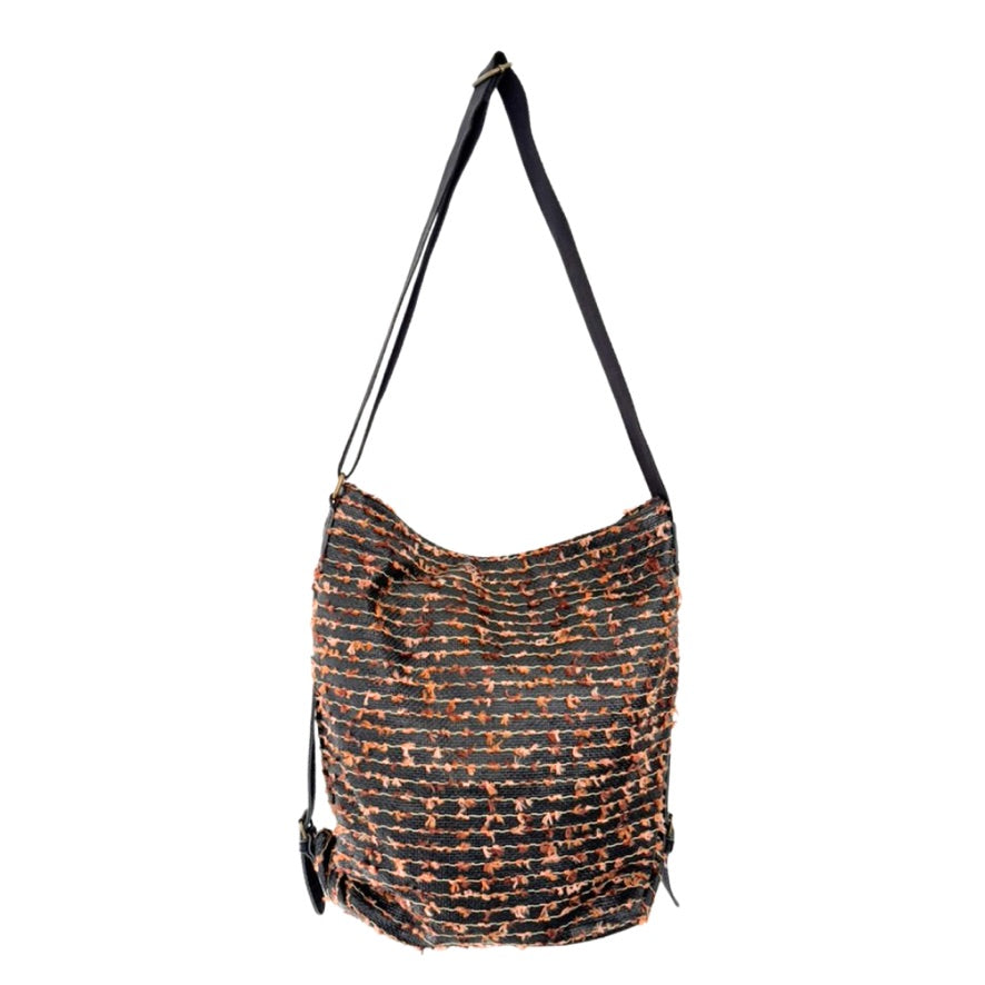 Brown and orange patterned bag with a strap on a white background