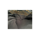 Close-up of a brown fabric with a textured pattern on a white background