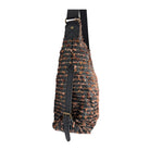 Sling bag with textured pattern on a white background