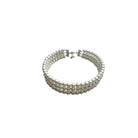 Multi-layered pearl bracelet on a white background