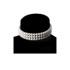 Pearl necklace on a black stand against a white background
