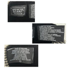 Close-up of fabric labels with text and branding on a white background