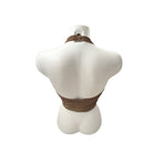 Mannequin wearing a brown leather top on a white background